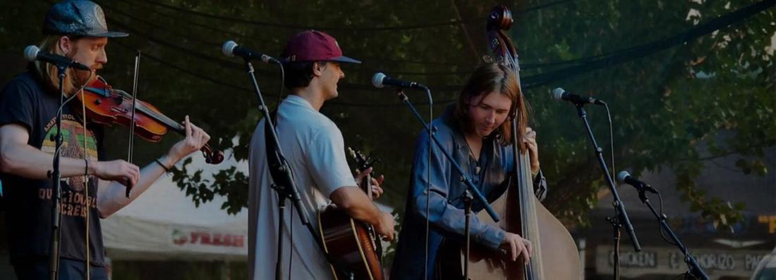 A trio playing on the deck