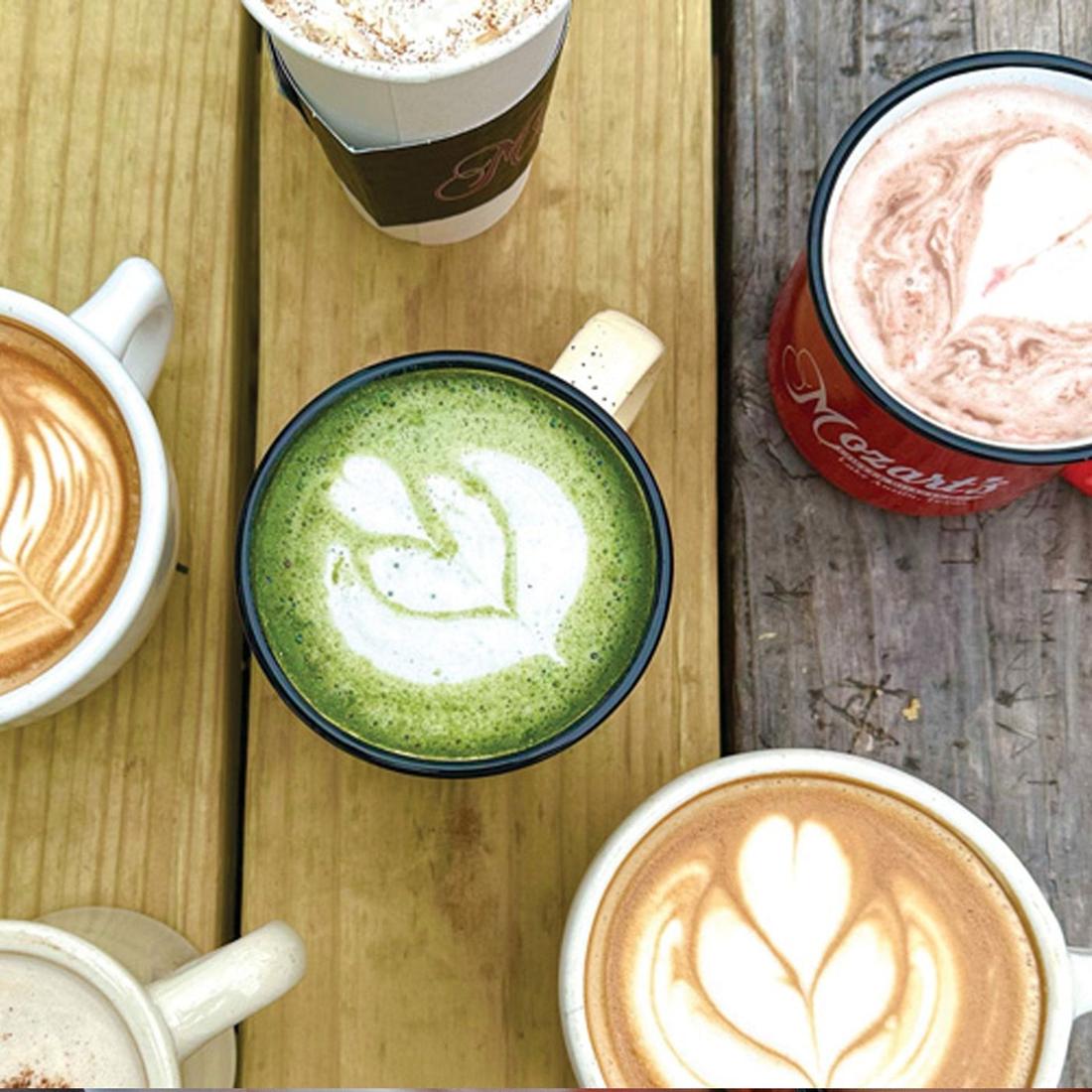 Lattes with latte art on a Mozart's table